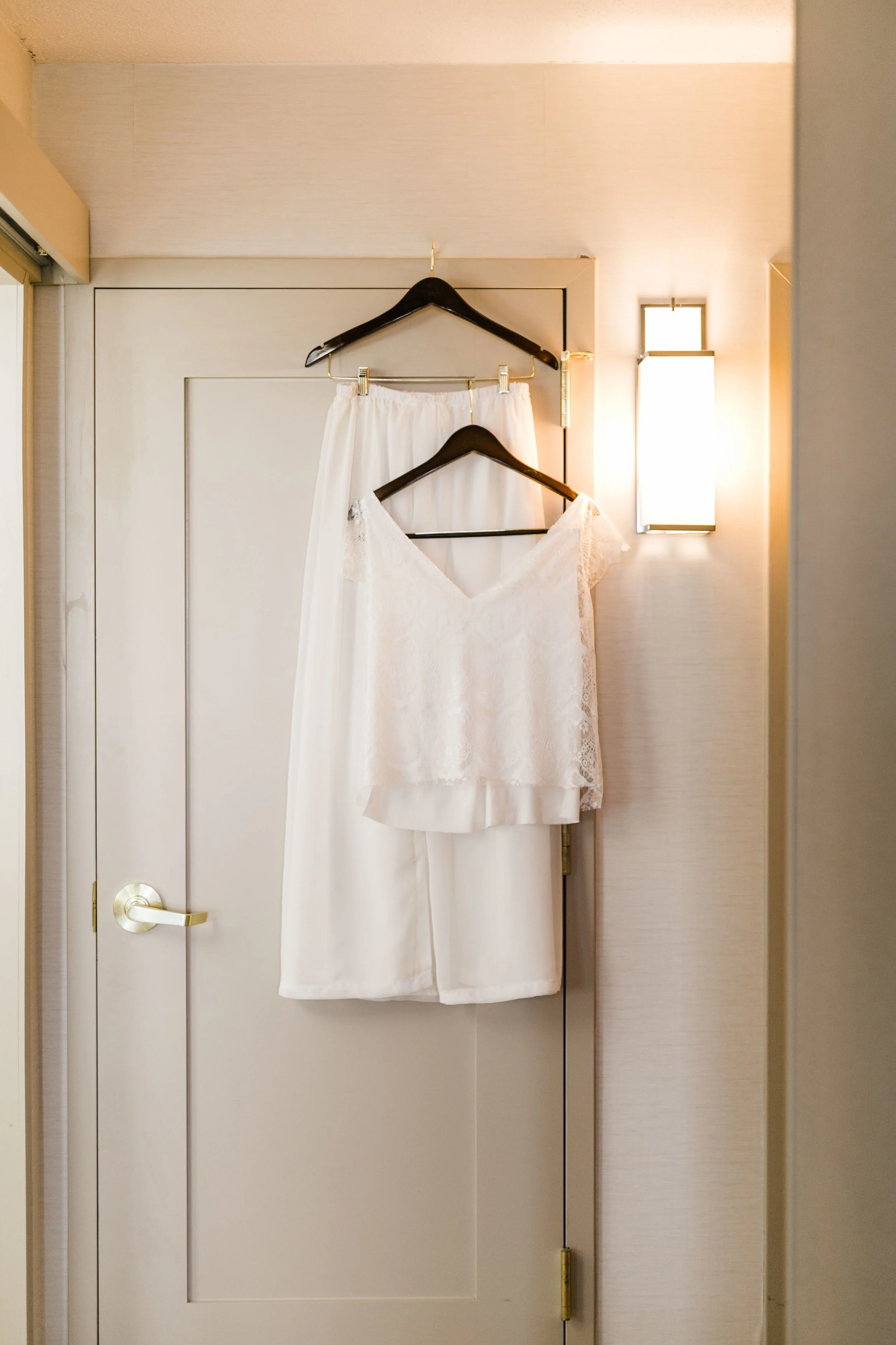 two piece diy wedding dress hanging in hotel room Hilton airport knoxville