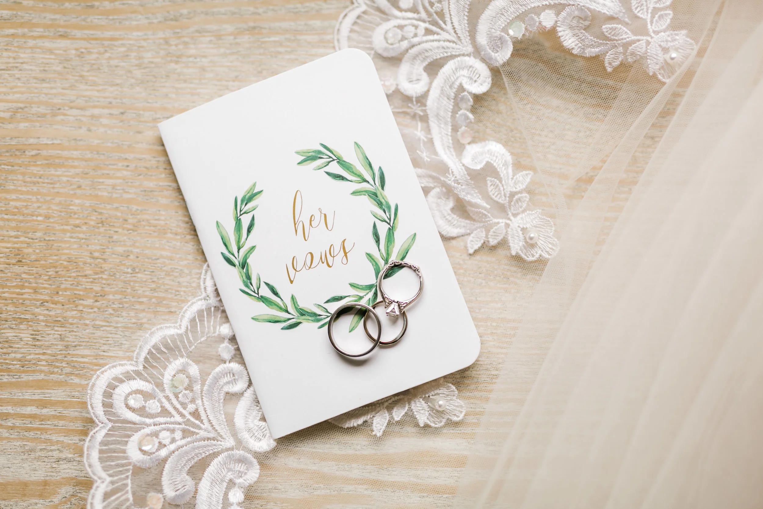 vow book and rings