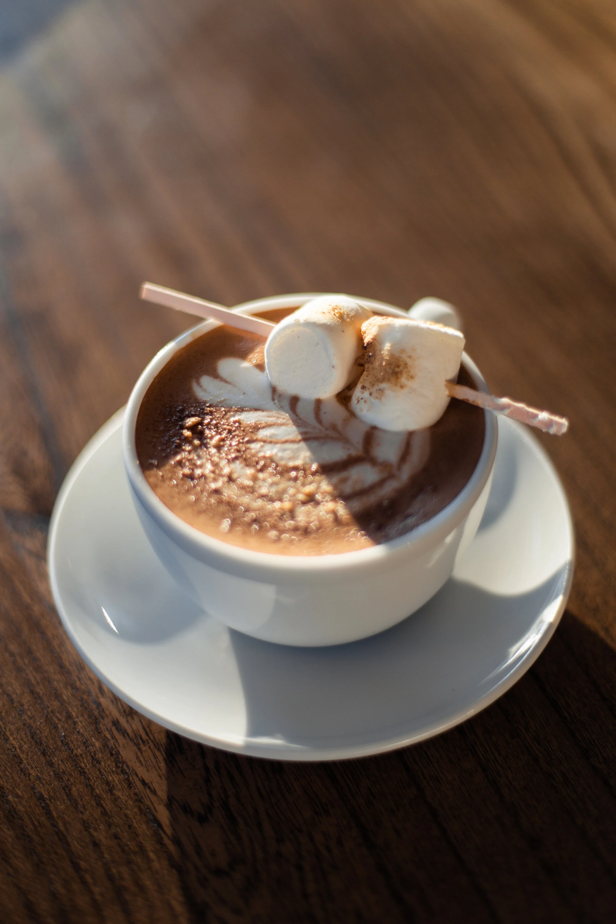 Nothing brings people together and is more synonymous with a bonfire on a crisp, fall night like the time-honored tradition of crafting the perfect S’more. Everyone has their own unique method for making one, and we wanted to show off how we do it here. Made with espresso homemade chocolate marshmallow syrup, steamed milk, and garnished with graham cracker dust and toasted marshmallows.