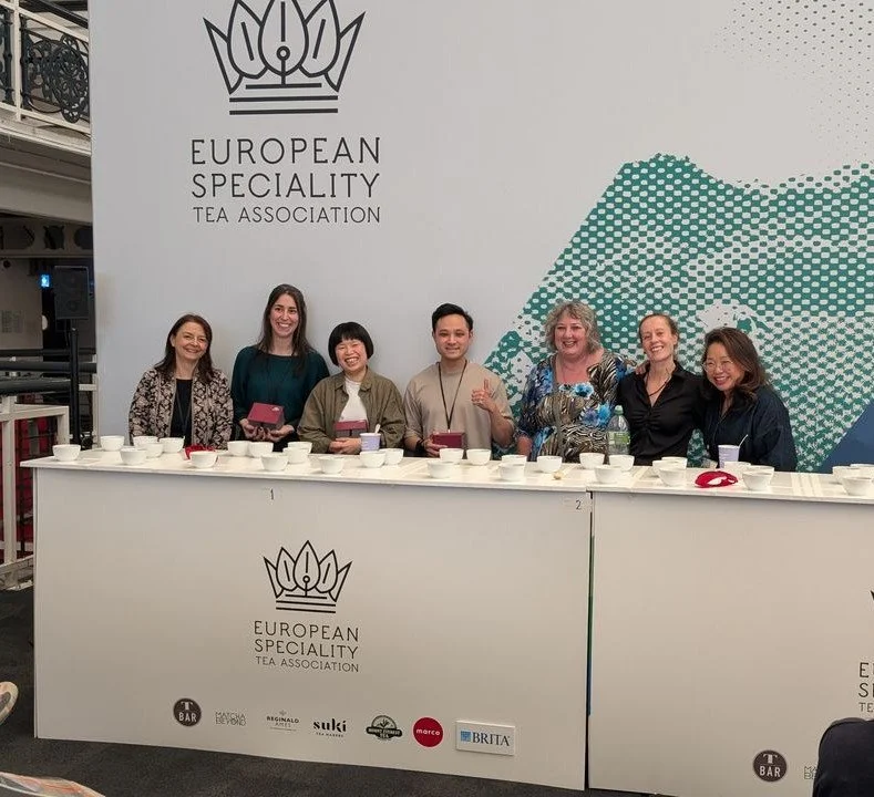 A group of people in front of the tasting stand