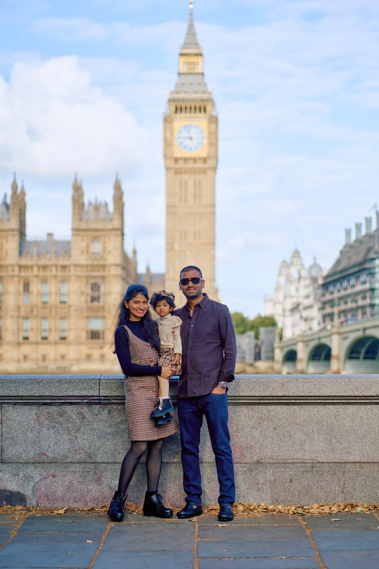 Family portrait on the Thames embankment near Westminster Bridge, London