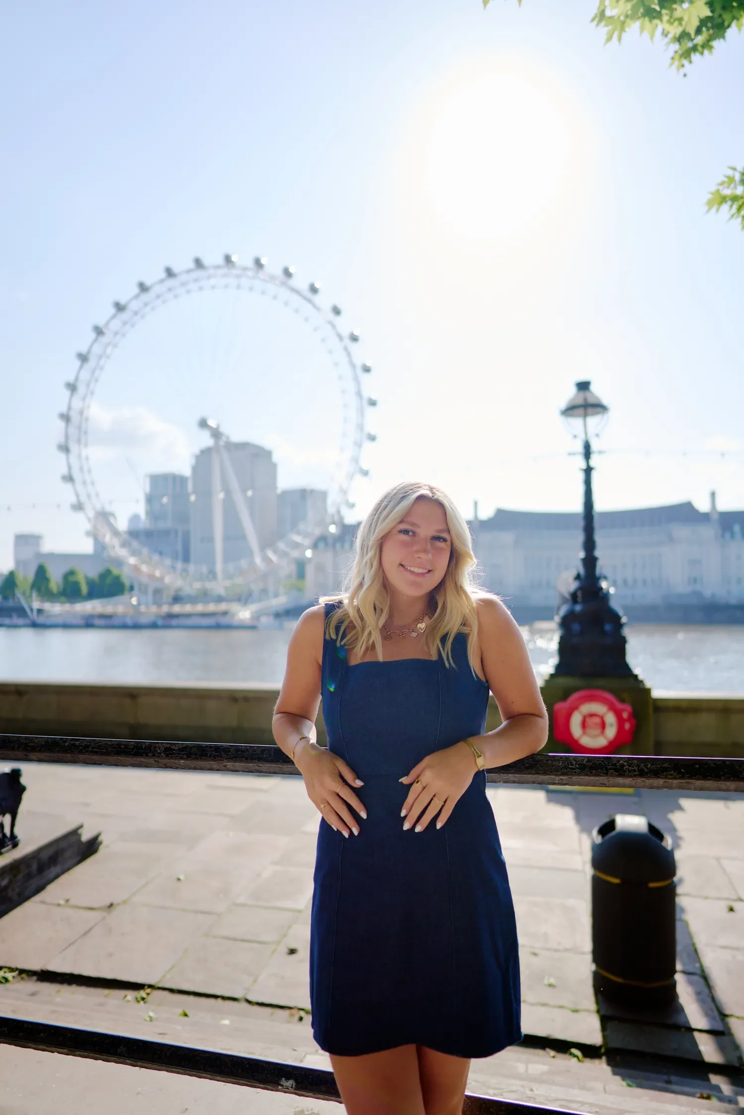 School senior portrait along the South Bank Thames path with the London Eye behind her