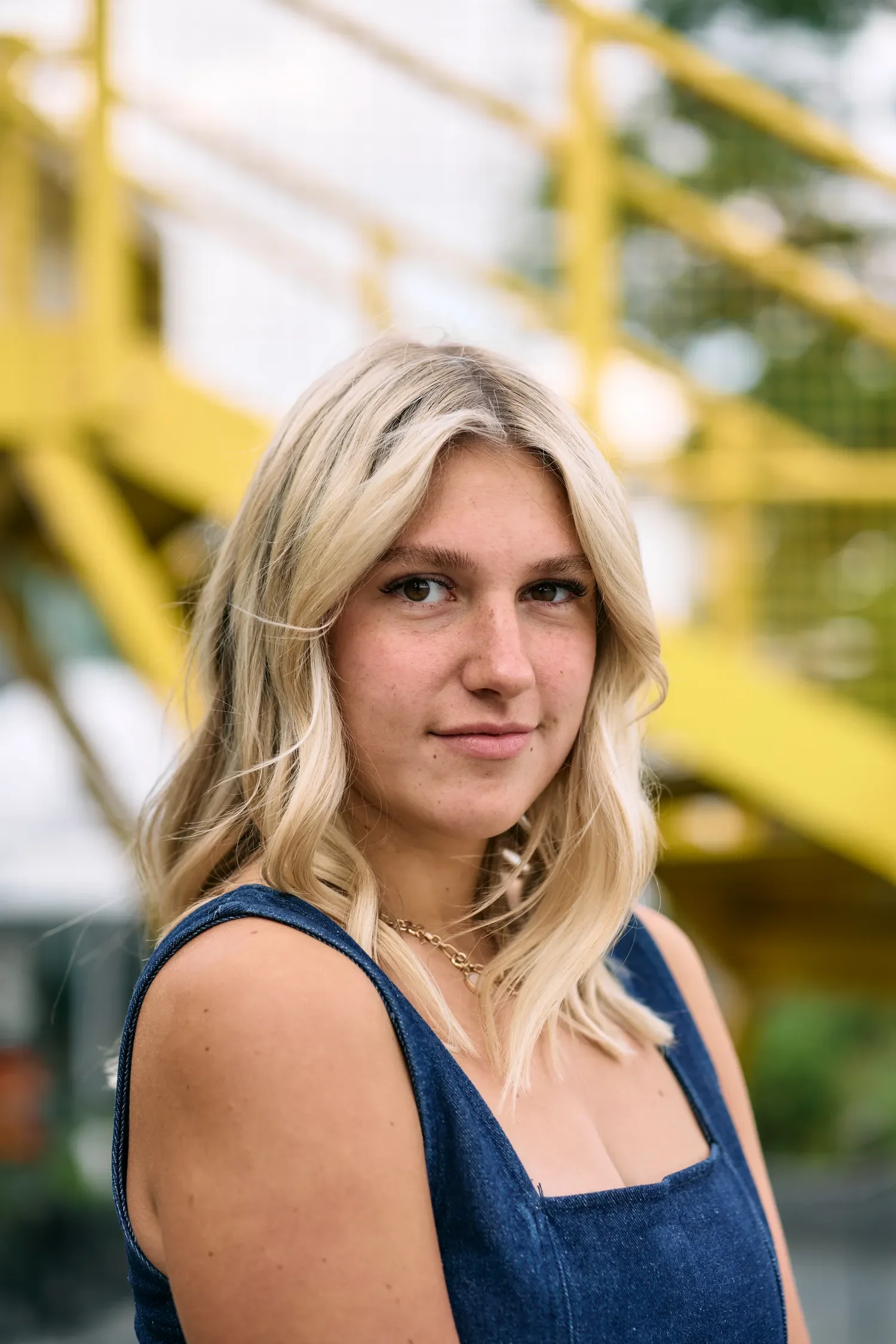 Close-up of school senior portrait on the South Bank yellow stairs in London