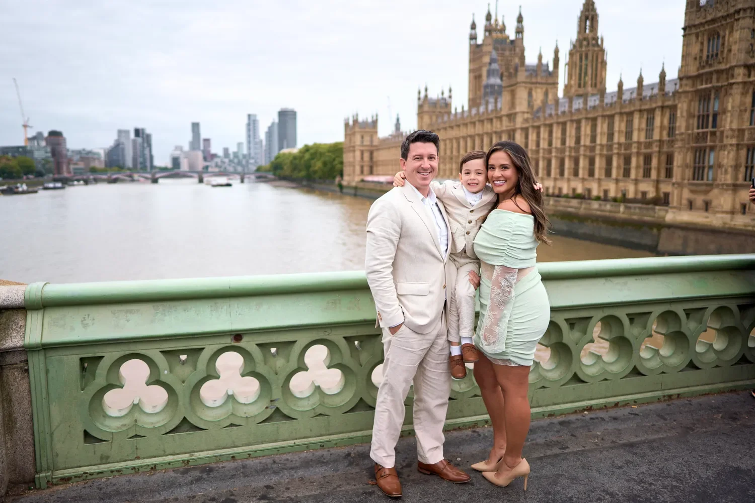 Family photoshoot on Westminster Bridge with Big Ben and the Thames in the background, London