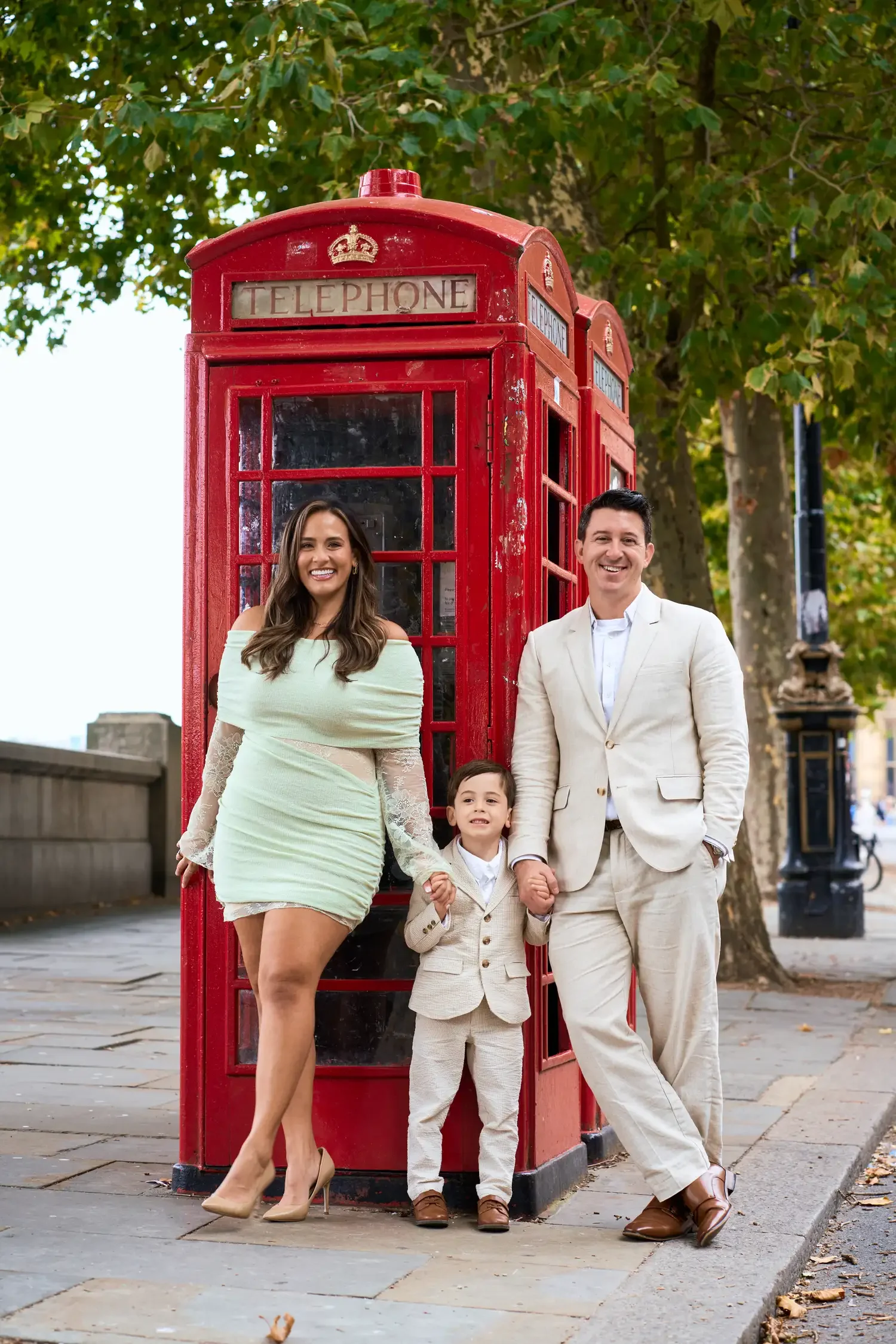 Family beside a red telephone box near Westminster Bridge, London photoshoot