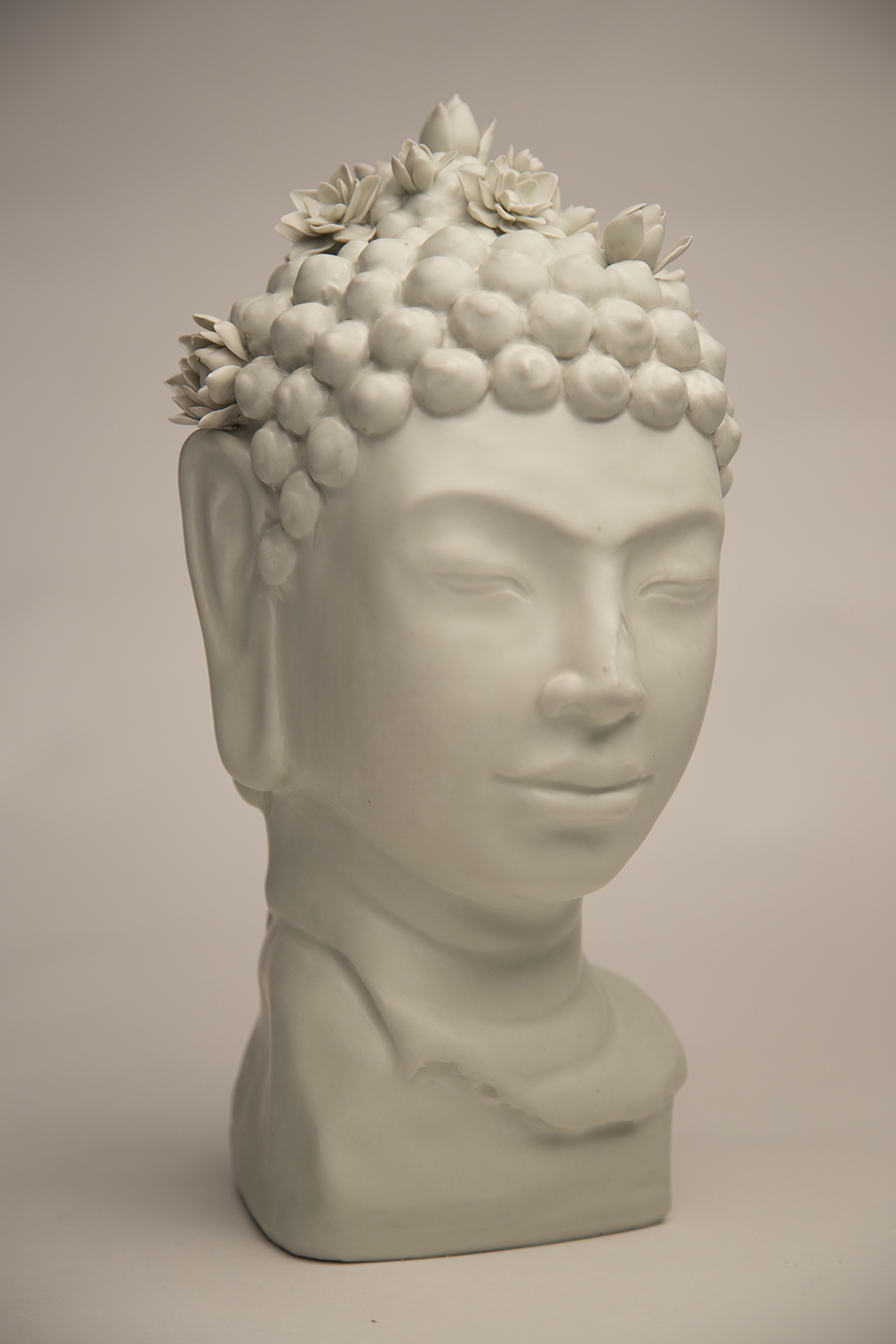 OA 1963.10- 16.1 Head of the Buddha given by the heirs of Dr Louise Elsa Samson (Lotus flowers)
