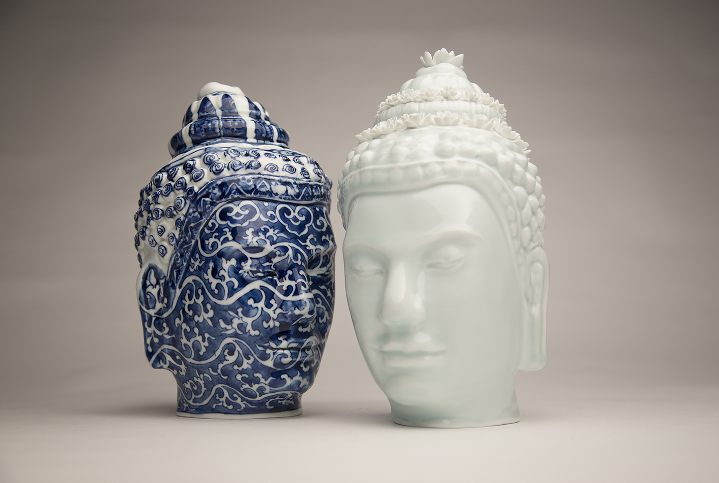  From left to right:  OA 1951.11-12.1 Head of the Buddha given by Colonel M. Earle (16th Century Ming Dynasty scroll pattern)  2016;  OA 1951.11-12.1 Head of Buddha given by Colonel M. Earle (Jade celadon with lotus flowers)   2016 Glazed porcelain w