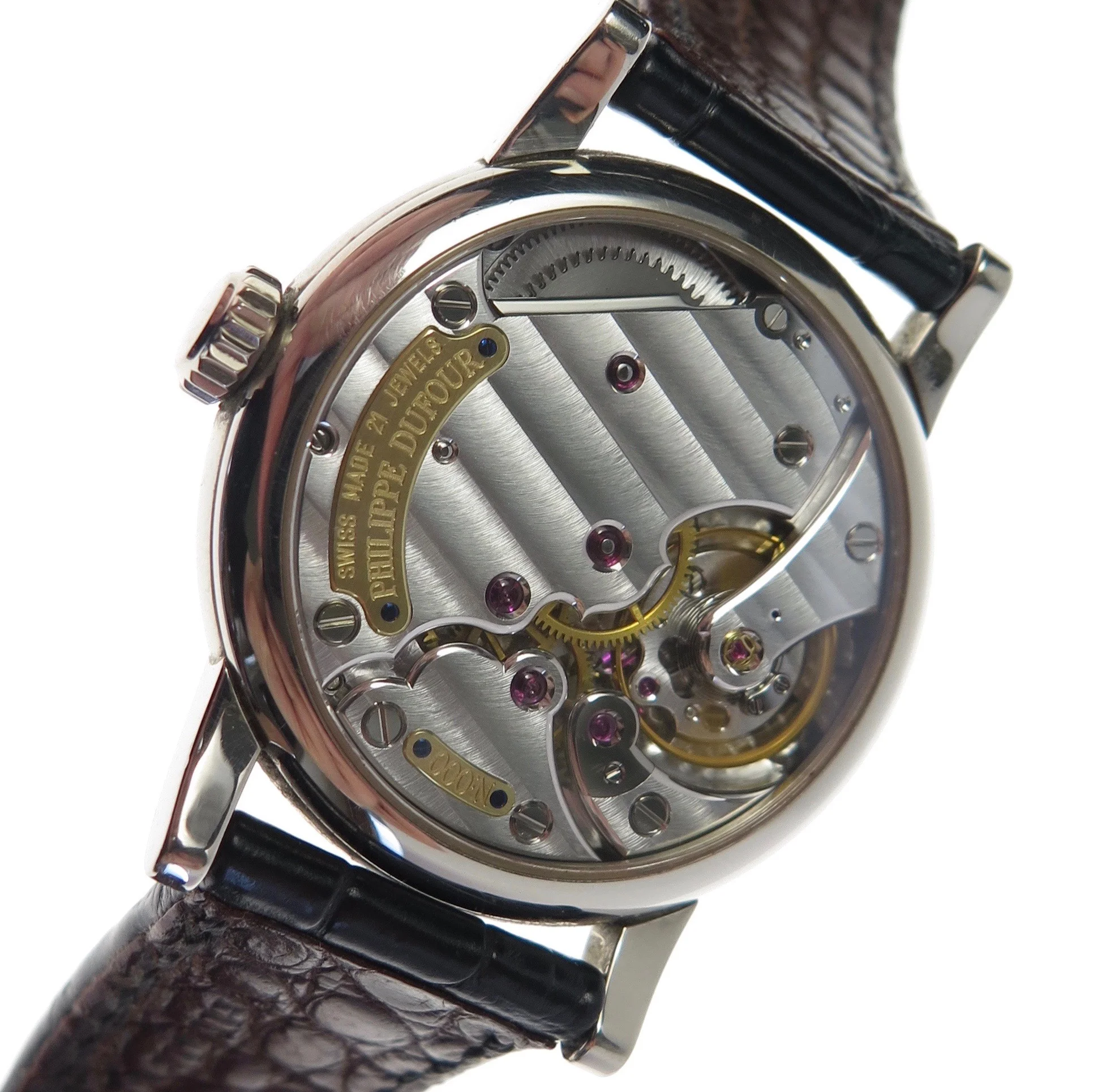 A view showing the fully assembled watch and the effect of the Geneva stripes brought to life by light. As the watch is moved light catches the Geneva stripes differently altering its aesthetic.