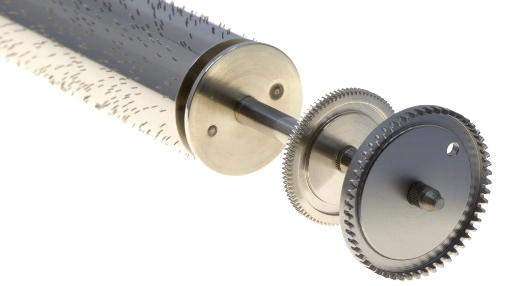 The dark grey contrate wheel drives the cylinder assembly.