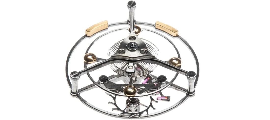 The cage is poised by the two 18-carat gold weights fixed to the opposite side to the escapement. Shown at the back of this image.
