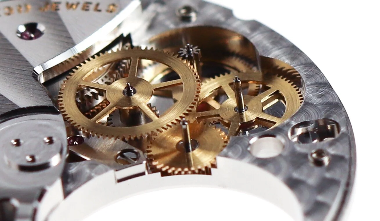 The tourbillon gear train, the small wheel at the centre of the image drives the cage.