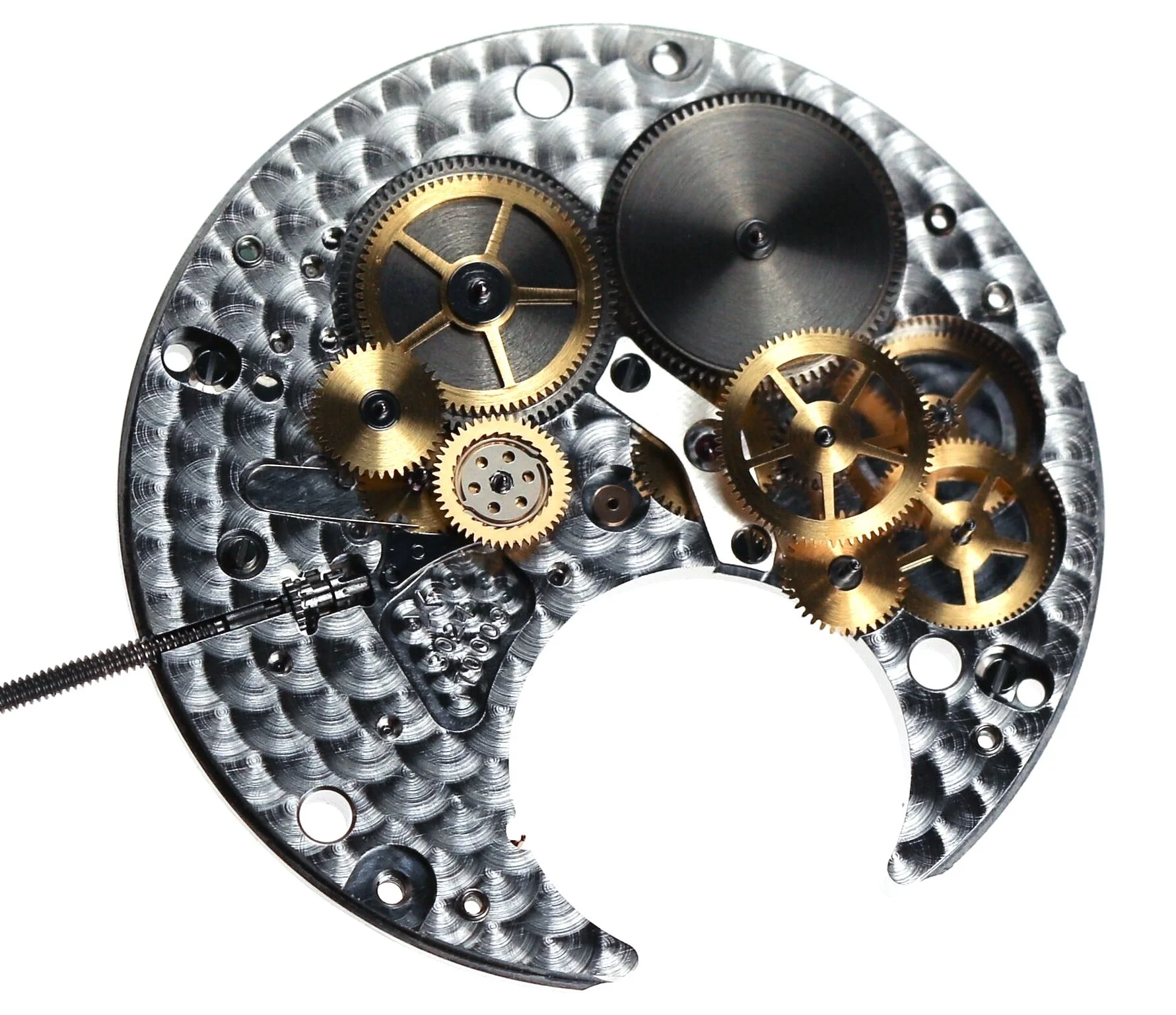 The mainplate with all wheels in place missing the bridges. To the left are the cluster of automatic wheels linking to the first barrel. To the right the gear train.