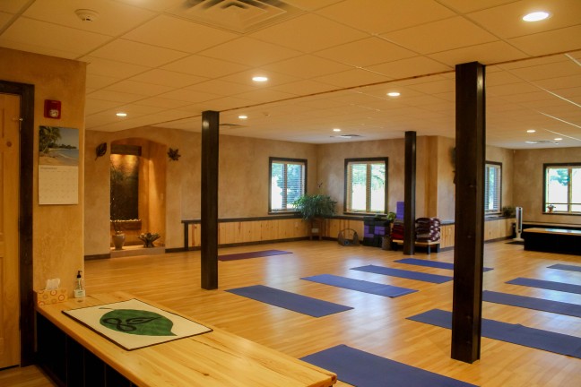 Open yoga studio with mats