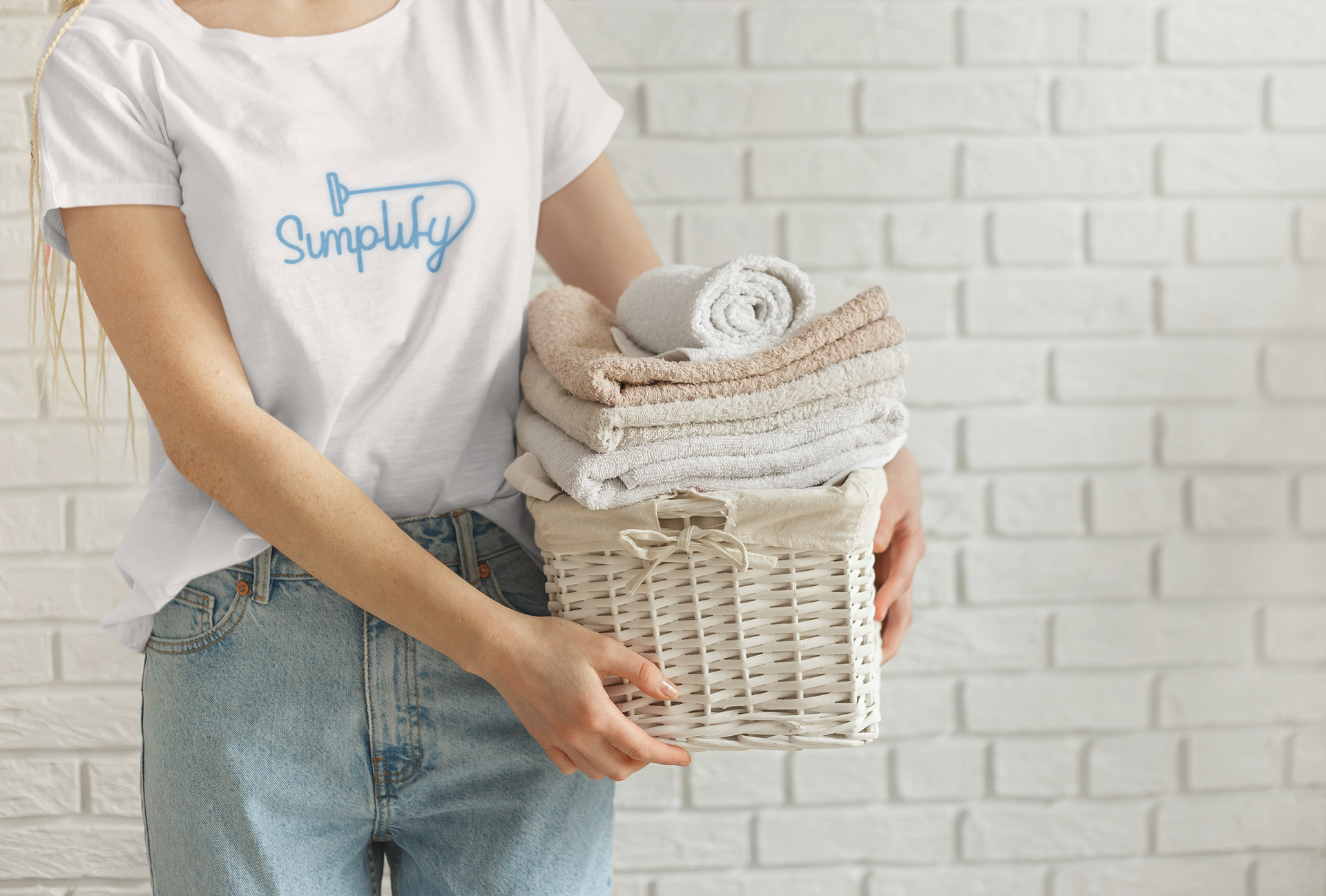 t-shirt-mockup-of-a-woman-holding-a-basket-of-clean-towels-34417-r-el2.png