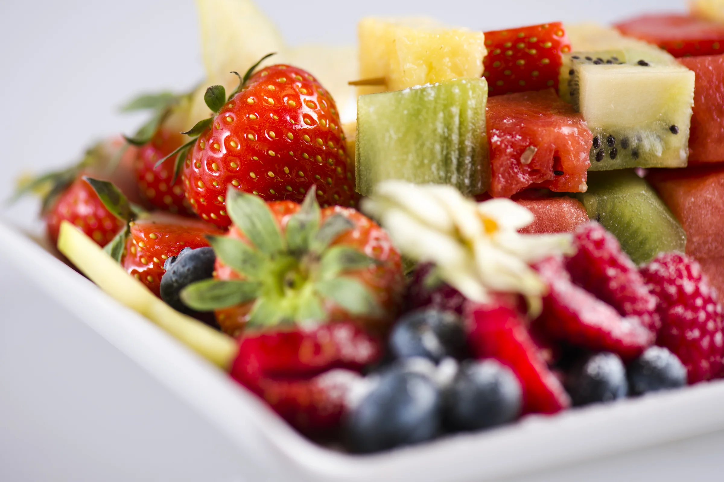 A plate of sliced seasonal fruit