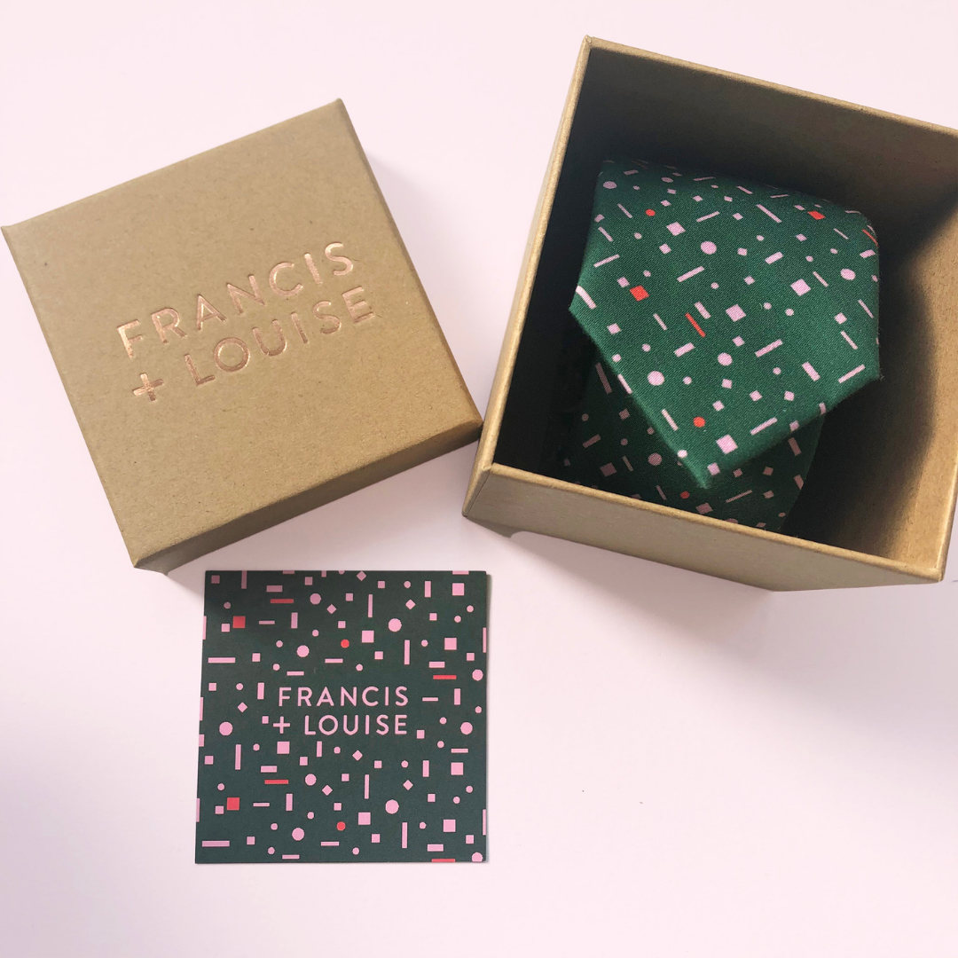 Green geometric print wedding tie in eco-friendly packaging from existing collection