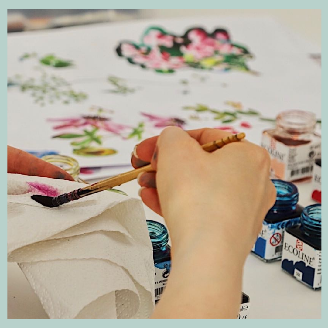 Francis + Louise designer painting bespoke prints for wedding accessories