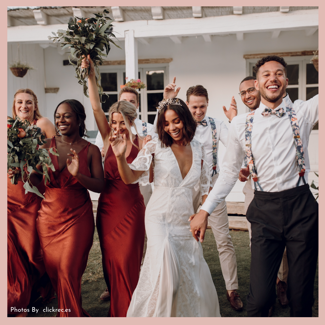 Adam &amp; Jessica’s wedding party dancing and wearing bespoke floral bow ties and braces