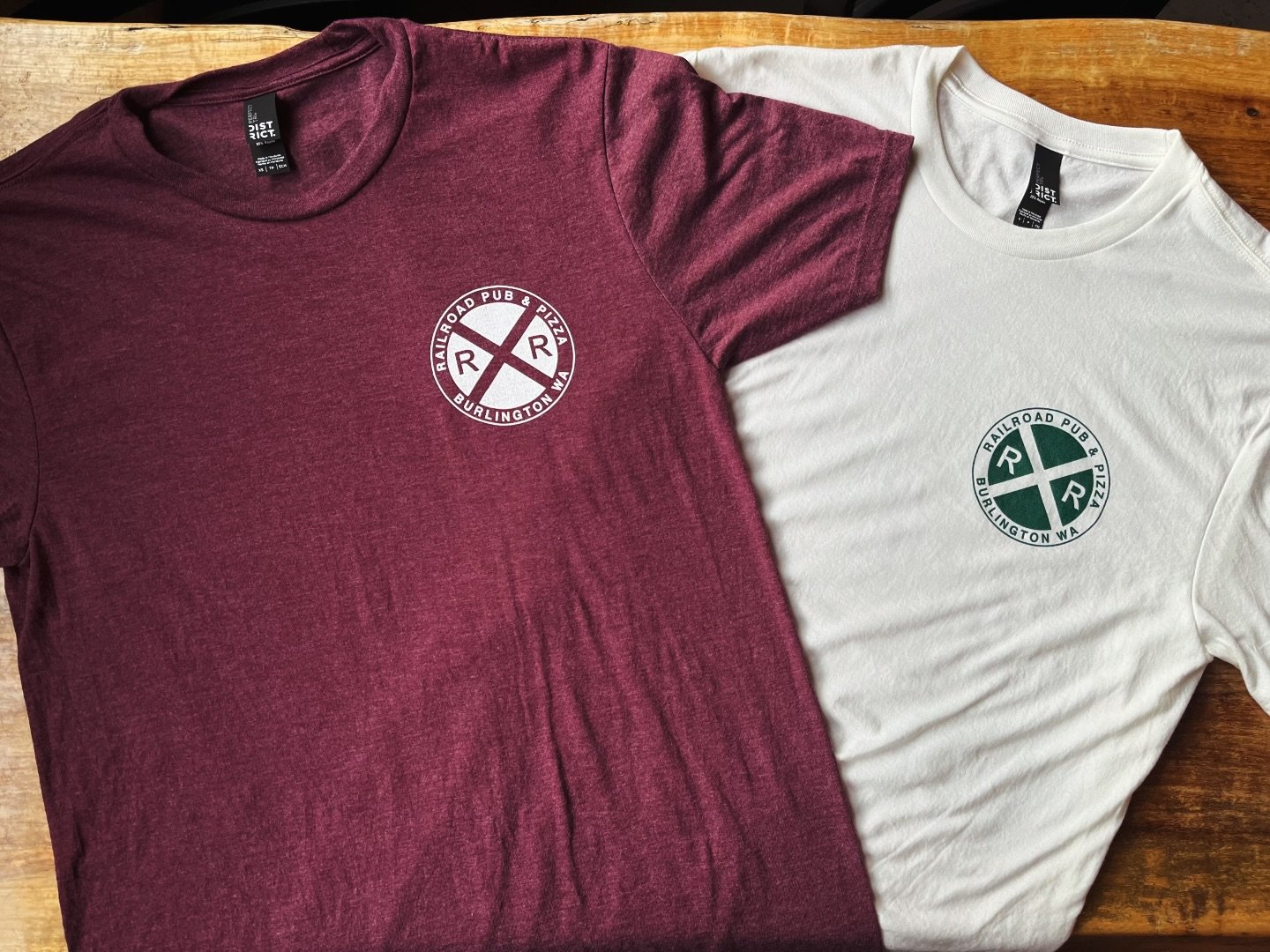 Holiday colored inspired tees are in! 🎄Perfect to wrap up under the tree this year&mdash;get your shopping done and support your locals! These are available in sizes XS-XXL.