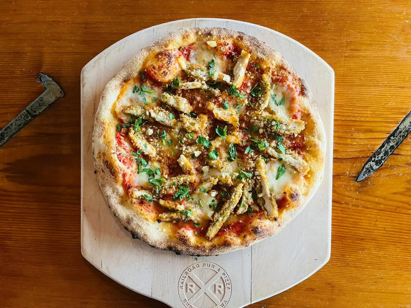 New special! Chicken Parmesan Pizza&mdash;Red sauce, fresh mozzarella, topped with a house made chicken parm, parsley, and shaved Parmesan.