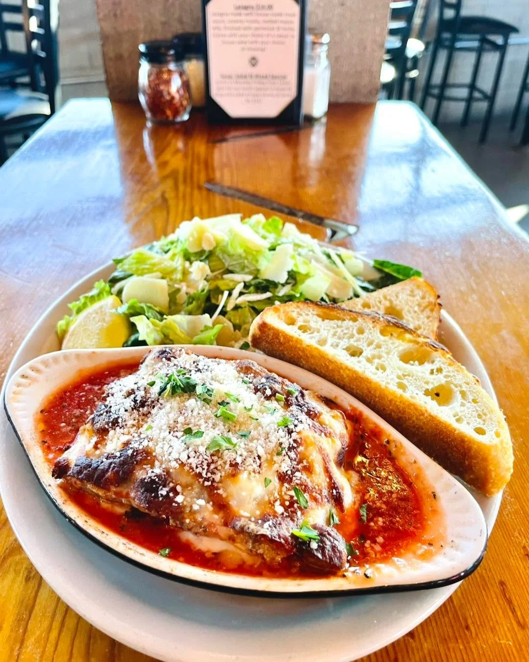 Lasagna is available for a couple more days, perfect for lunch or dinner! Made with a house-made meat sauce, creamy ricotta, melted mozzarella finished with parmesan &amp; herbs. Served with  fresh focaccia and your choice of a caesar or house salad.