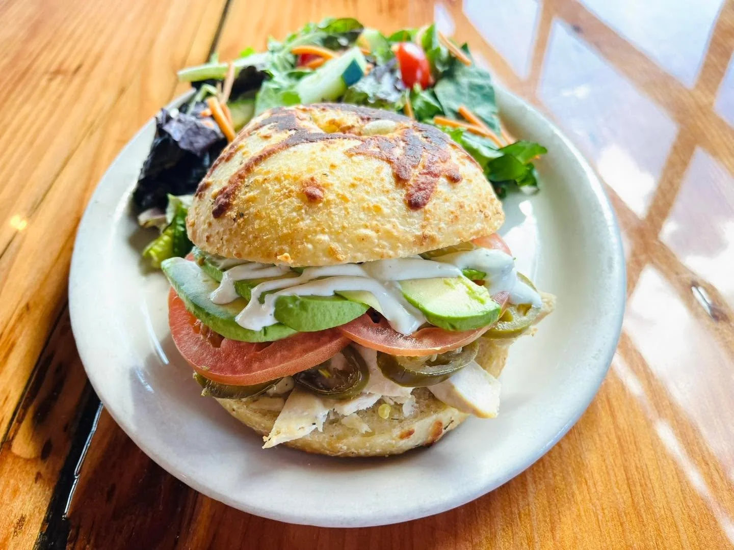 A little heat, a lot of flavor 🔥🥑 Our new Baja Chicken Sandwich special is stacked with herb-marinated chicken, melty pepper jack, jalape&ntilde;os, fresh avocado, and house-made avocado lime crema. Soup or salad included &mdash; $19.