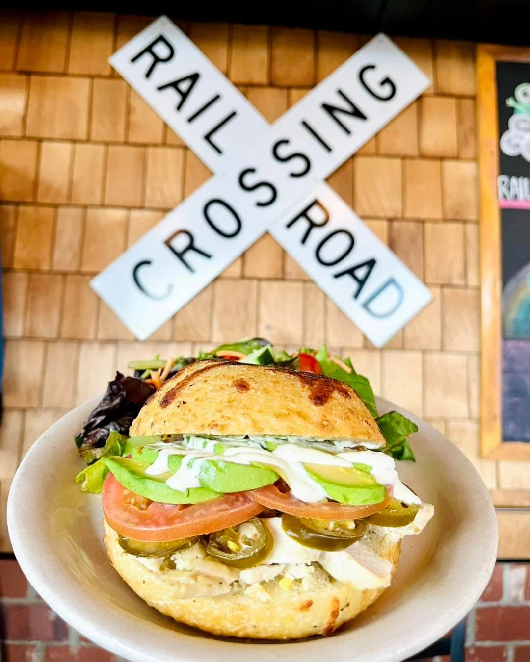 Our Baja Chicken Sandwich special is stacked with herb-marinated chicken, melty pepper jack, jalape&ntilde;os, fresh avocado, and house-made avocado lime crema. Soup or salad included &mdash; $19.