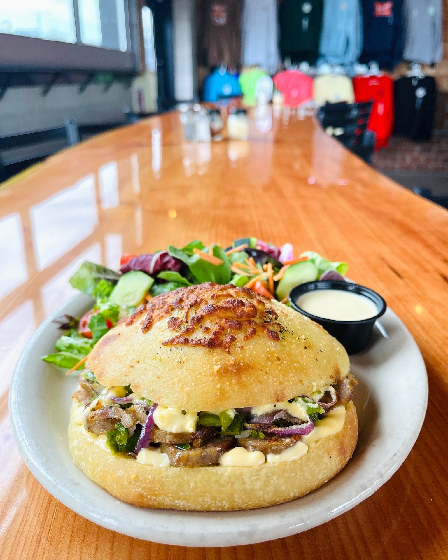 Last call for the Italian Job! Local Jack Mountain Meats Italian Sausage, diced green peppers, and red onion topped with a melted cheddar and mozzarella sauce on our focaccia roll. Served with your choice of soup or salad, $19. Available today and Fr
