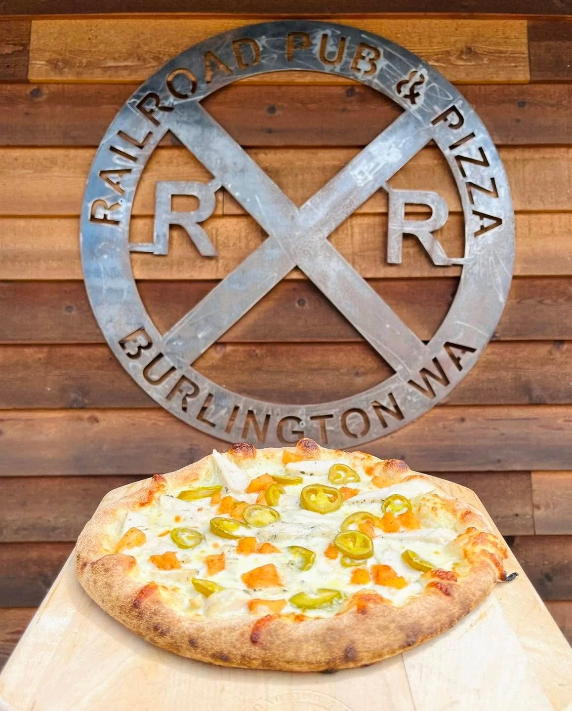 We are open late on Fridays and Saturdays, dine with us until 10pm here at Railroad! Try the HWY 20 Hawaiian pizza special. Our house made ranch, shredded mozzarella, and chicken topped with pineapples and jalape&ntilde;os.