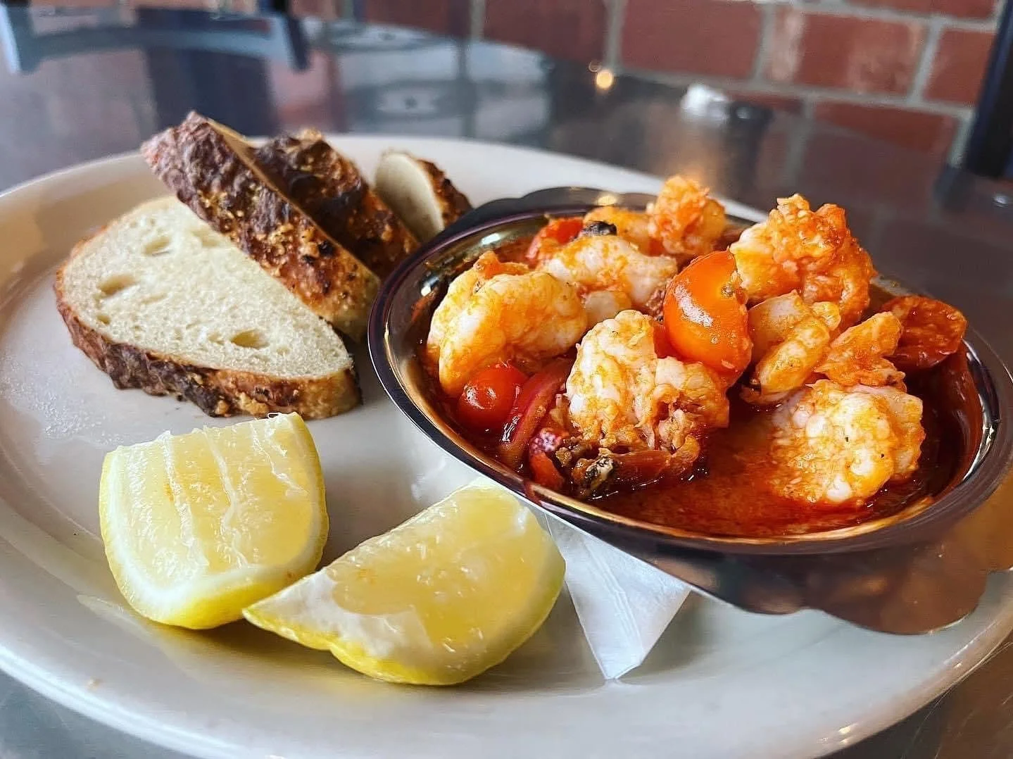Order this for the table to share or order one just for yourself! Our Spicy Fire Roasted Prawns are served with bacon, cherry tomatoes &amp; red onion, garnished with parmesan served with focaccia. Yum!