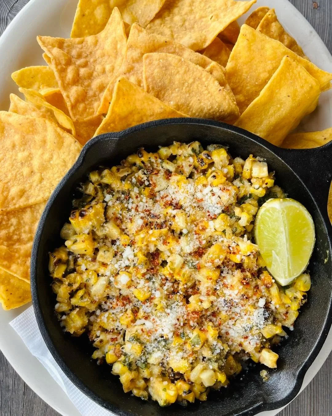 🚨 LAST CALL! 🌽 Come in today for our Elote Dip. Made with fresh roasted corn from Frazier Farms, jalape&ntilde;o, green onion, cilantro, and topped with Tajin and cotija cheese. Served with Train Wreck Bar &amp; Grill&rsquo;s house made tortilla ch