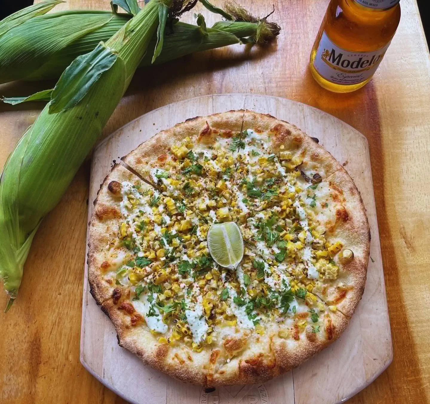 Don&rsquo;t miss our Elote Pizza! It&rsquo;s bringing all the Mexican street corn flavor to the party! Fresh, locally sourced roasted corn from Schuh Farms and shredded mozzarella, topped with Cotija cheese, cilantro, lime, Taj&iacute;n, and Mexican 