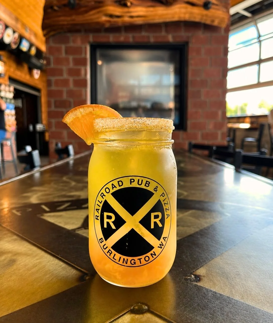 Try our Mandarin Margarita made with Craftwell Cocktails Margarita with mandarin orange juice, muddled mandarin oranges and lime simple syrup. Topped with lemon lime soda and served with an orange sugar rim!