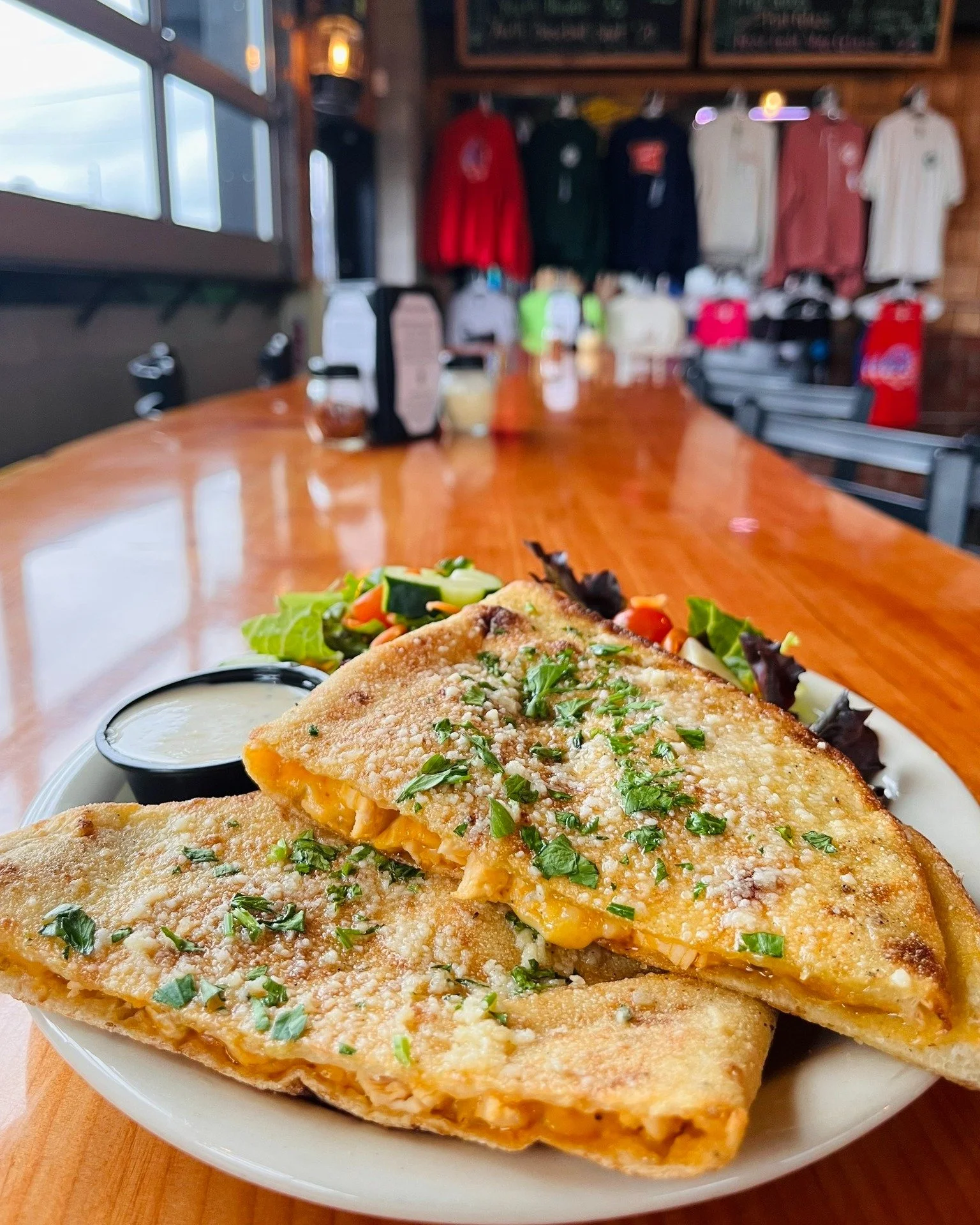 What are your weekend plans?! Make time and come in for our Sweet &amp; Spicy Chicken Melt. A house made sweet and spicy sauce drizzled over diced chicken with a cheddar and mozzarella blend on a folded flatbread. Topped with parsley and garlic oil, 