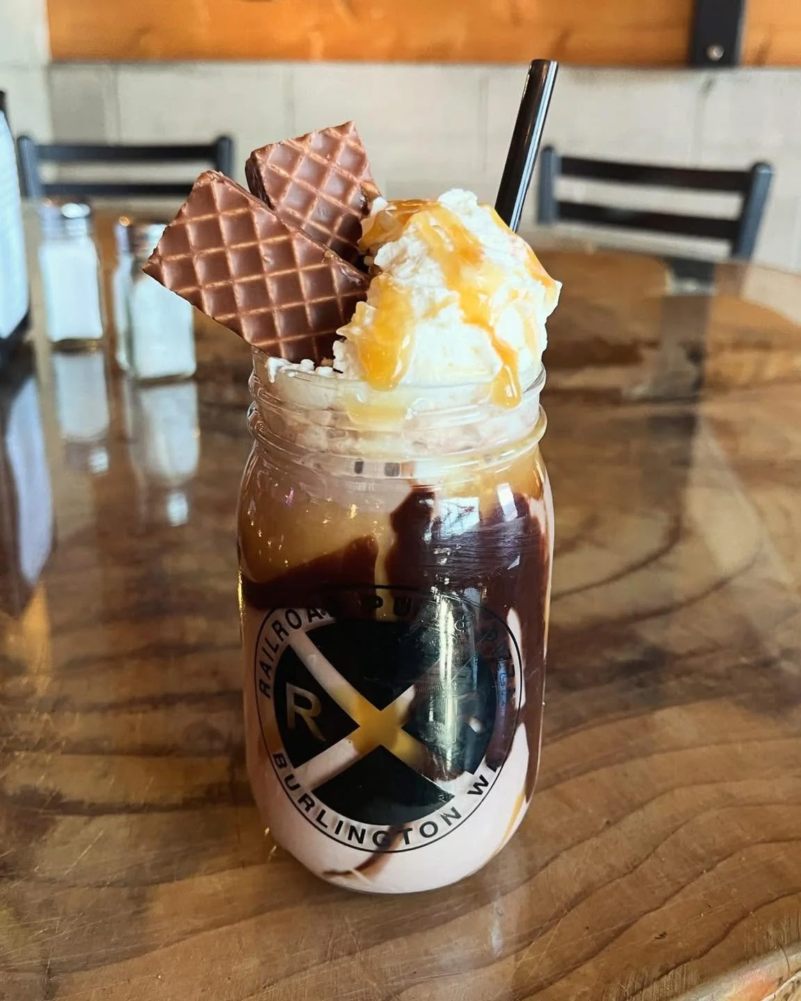 You don't have to be a kid to enjoy a Gooey Graveyard&mdash;this treat is great for everyone! Made with local Twin Brook Creamery chocolate milk, drizzled with chocolate sauce and caramel sauce then topped with whipped cream, more caramel, and a Nutt