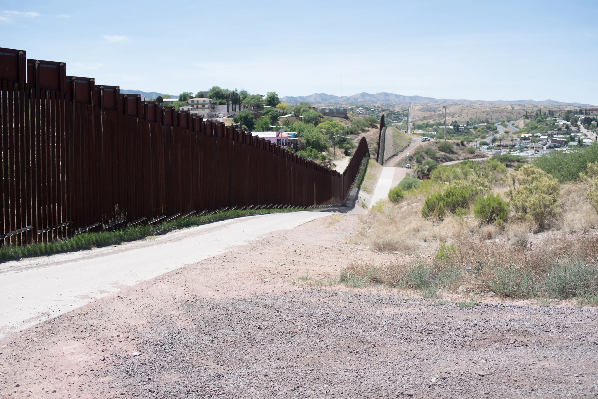The wall was installed in more geographically accessible regions of the border, such as Nogales, Arizona, pushing migrant routes into areas that had not historically been trafficked.jpg