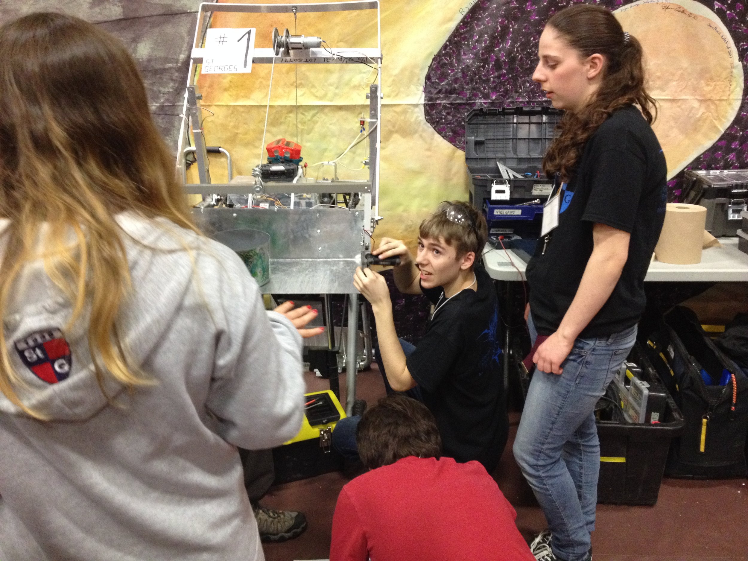 Sevy working on the CRC robot in the pit