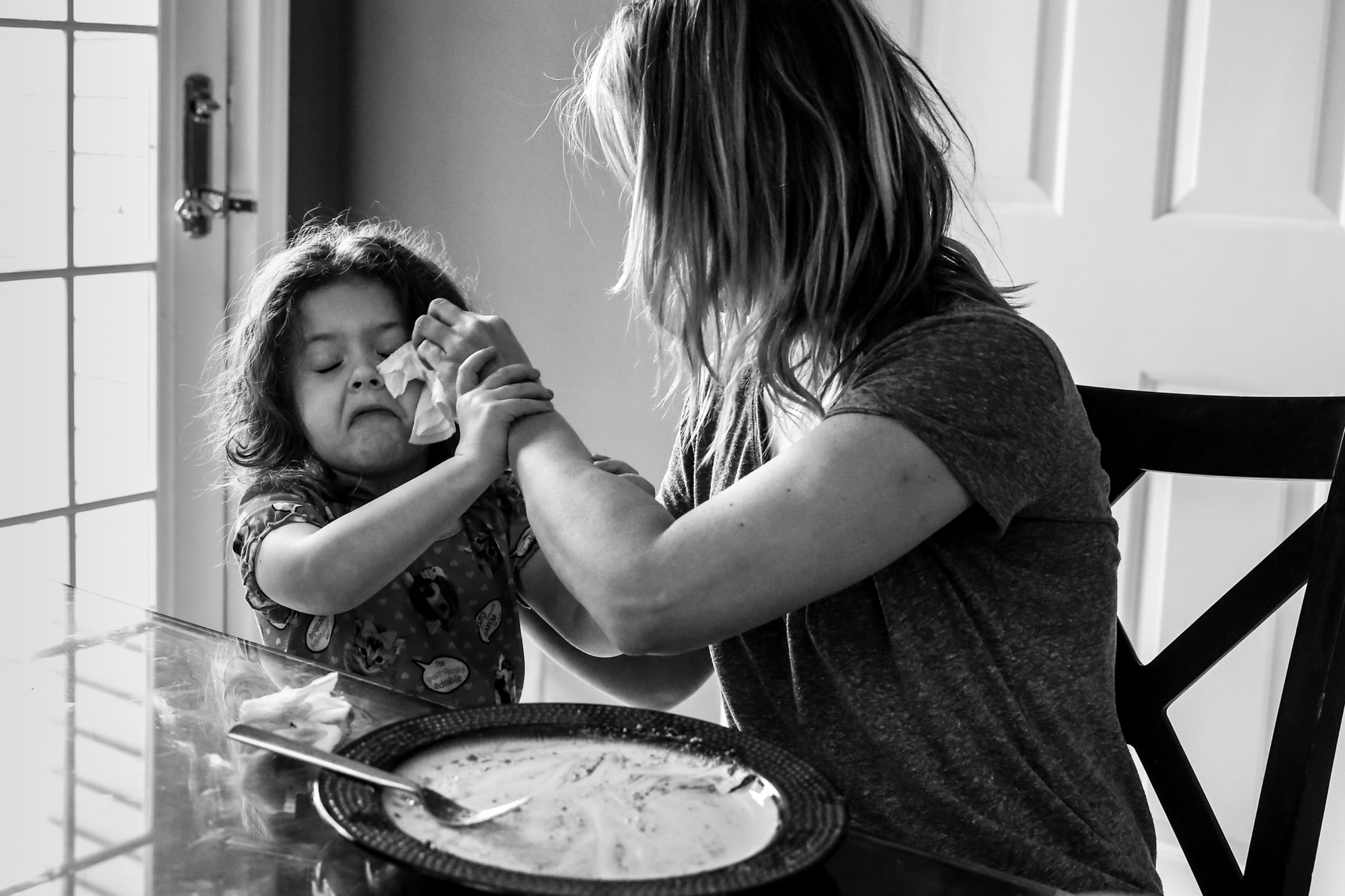 Girl gets faced wiped after breakfast