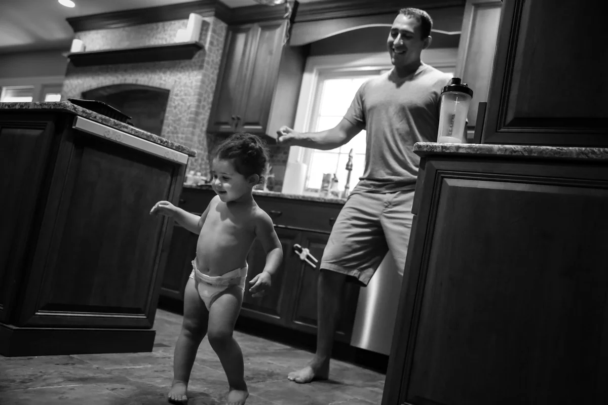 Girl in diaper dances with man
