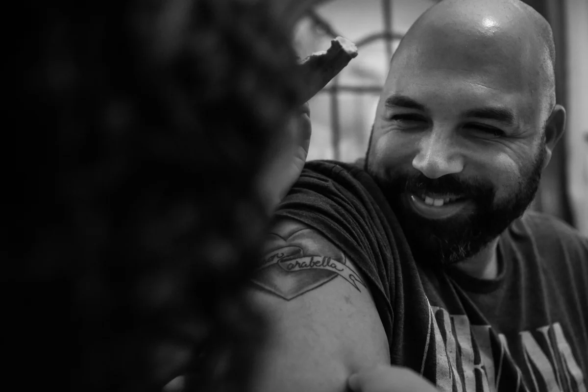 Man smiles at daughter