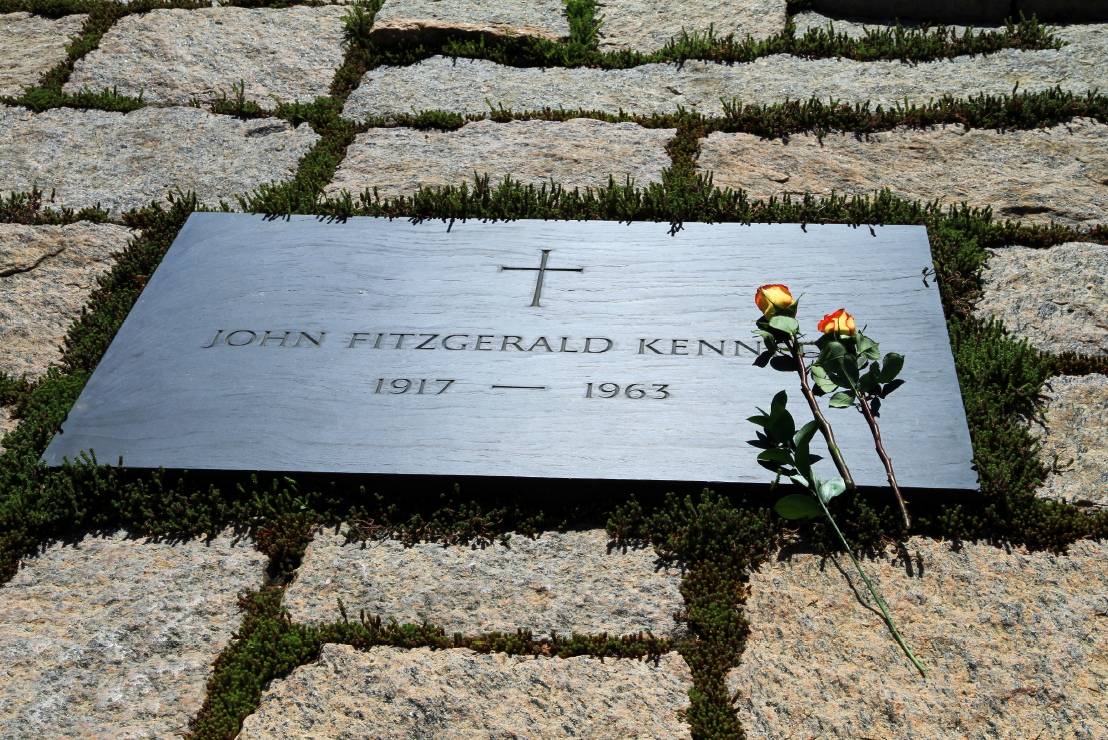 A simple plaque marks the grave of President John F. Kennedy.