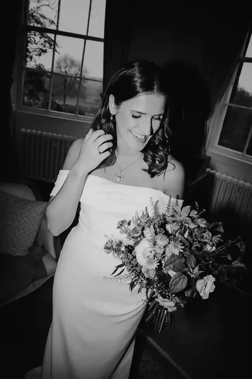 A bride holding her bouquet at Middleton Lodge