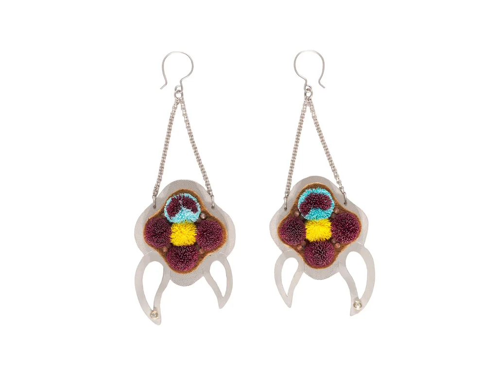 Caribou tufted earrings set on sterling silver with peach moonstone beads, with a diamond set in 18k gold.