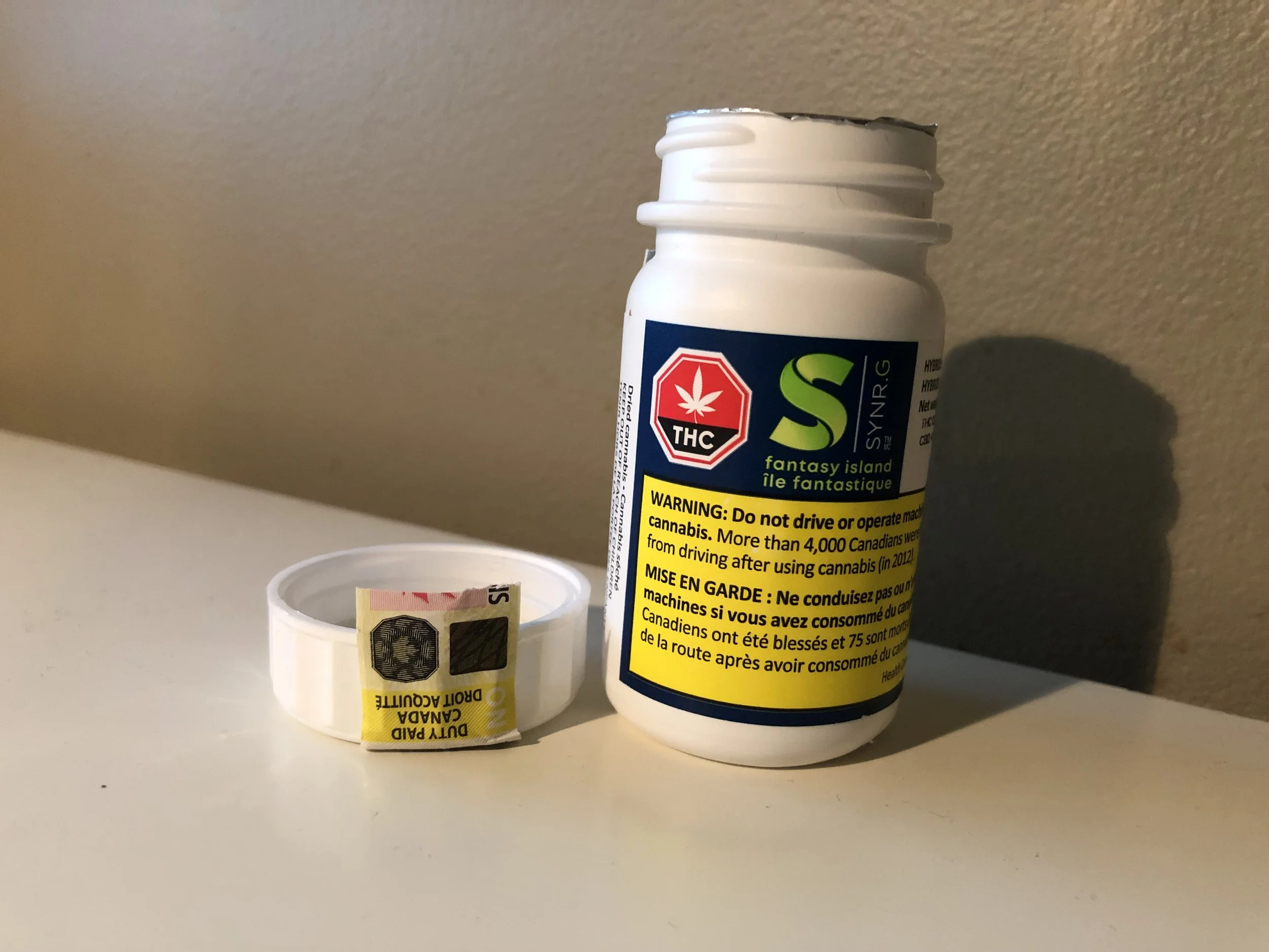 The Pill bottle style packaging, with silver seal