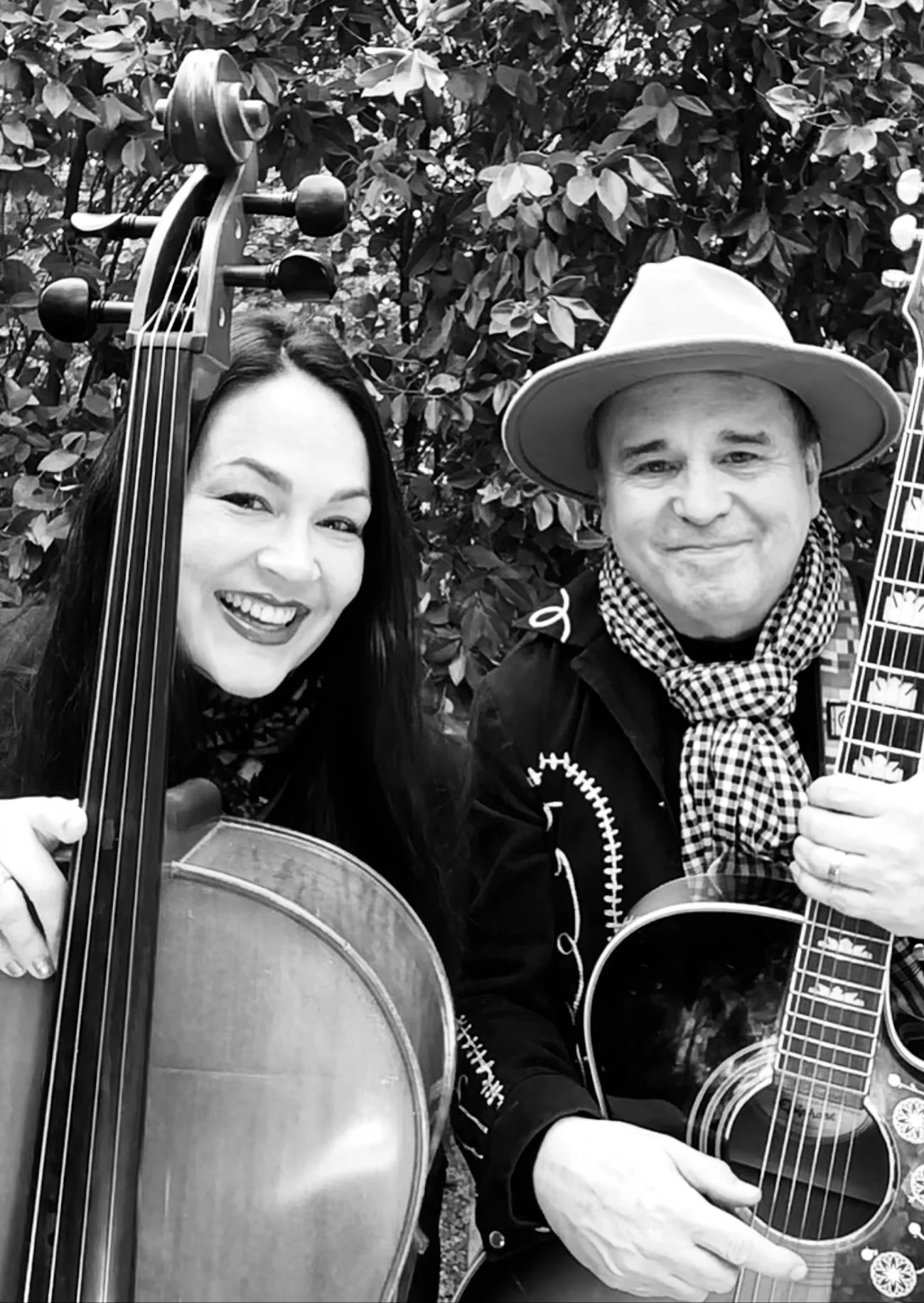 JAMES ERIN SMILING W INSTRUMENTS PORTRAIT BW 300 DPI.jpg