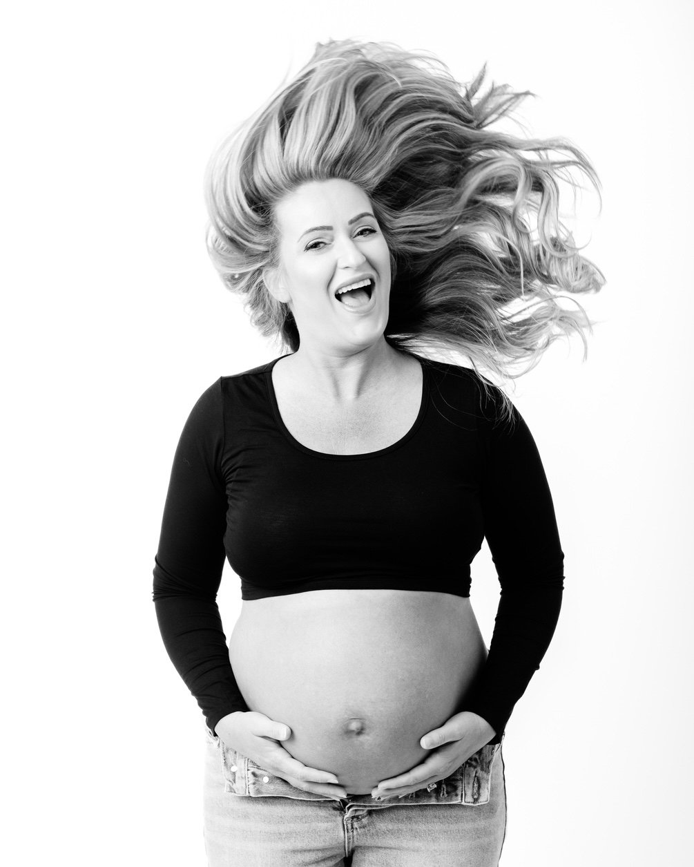 No studio maternity session would be complete without a fun hair flip shot.
