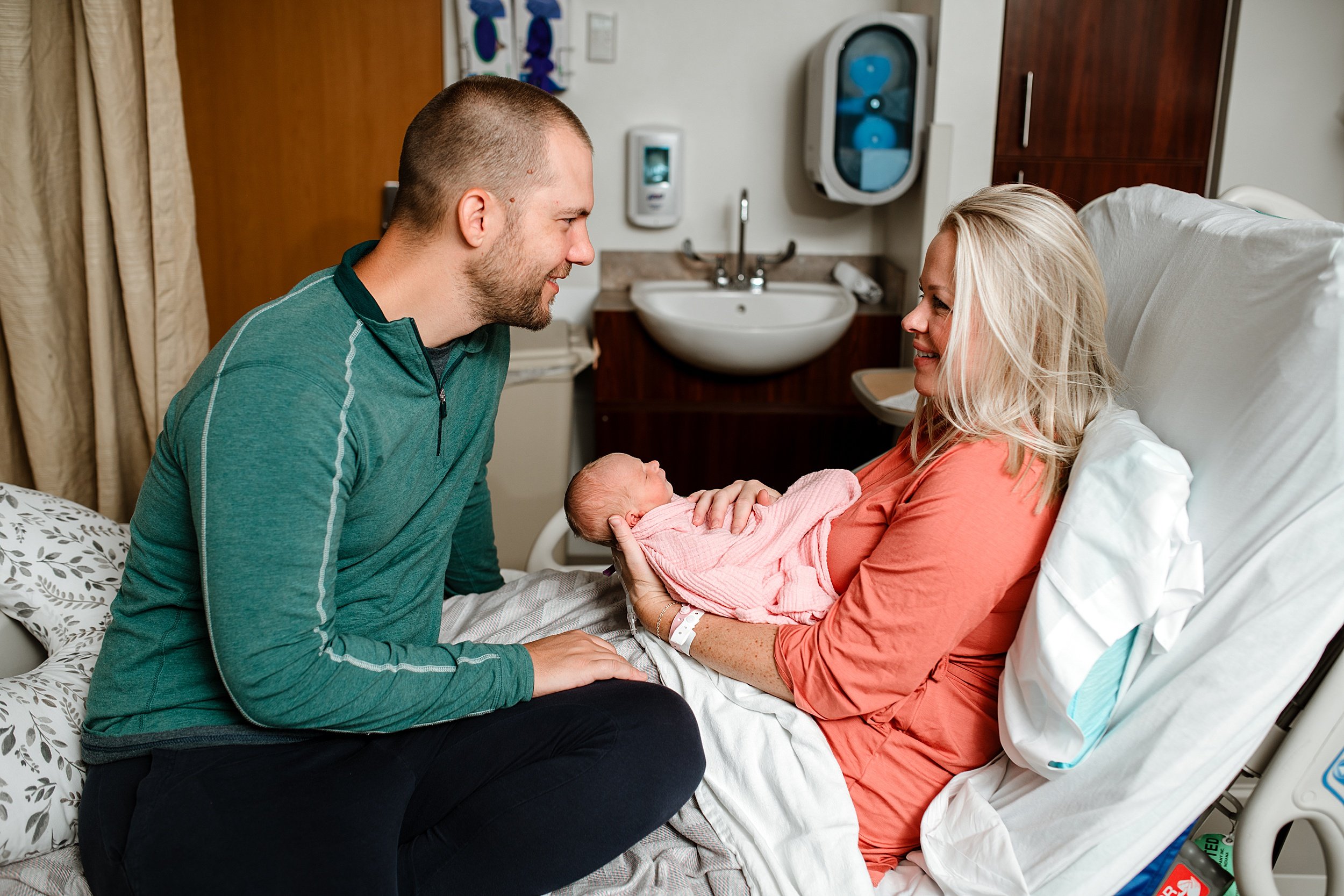 Parents holding their newborn baby in a Pensacola hospital