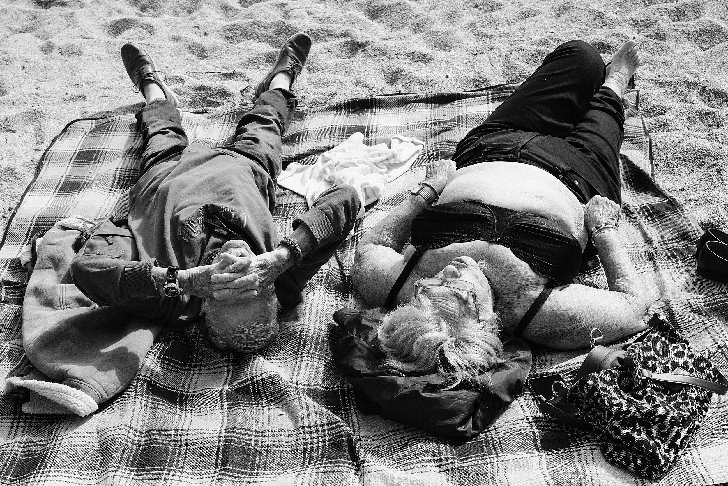 Candid Street Photography of an Elderly Couple Relaxing on the Beach in Villefranche-sur-Mer, France-3.jpg
