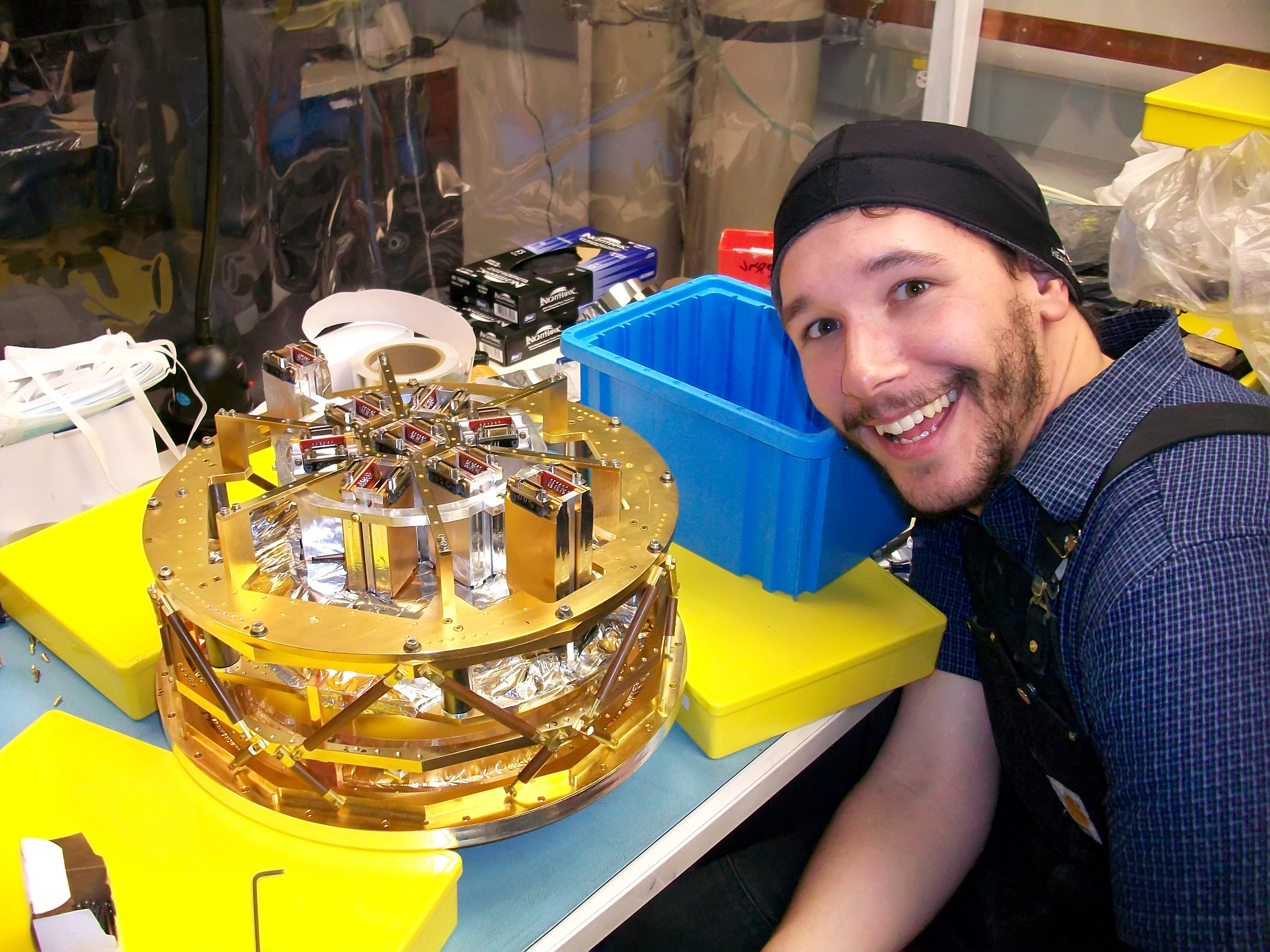 Me and the back side of the SPTpol focal plane. Credit: Bradford Benson.