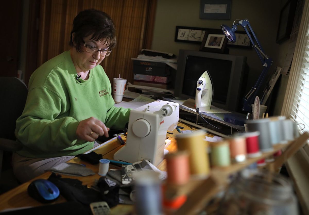 Thea Gain in her workshop creating a custom Blessing Bear for a customer.